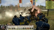 Total War: SHOGUN 2 - Fall of the Samurai - A land battle depicting conflict between a traditional Samurai bow unit and a rifle-bearing Shinsegumi Police unit.