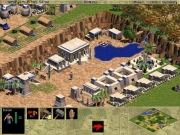 Age of Empires - Ein kleiner Wasserfall strömt aus einem Waldgebiet. Die Zivilisation befindet sich in der Eisenzeit.